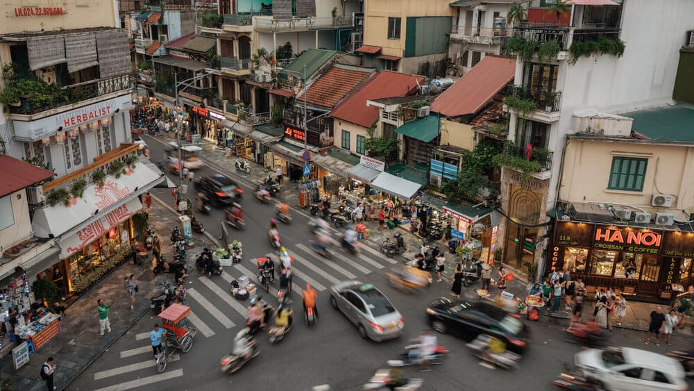 Crossing busy streets in Hanoi Old Quarter