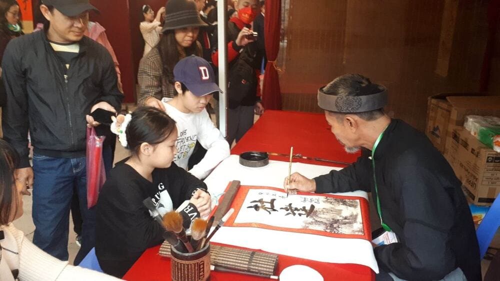 Calligraphy tradition at Temple of Literature during Tet festival Hanoi